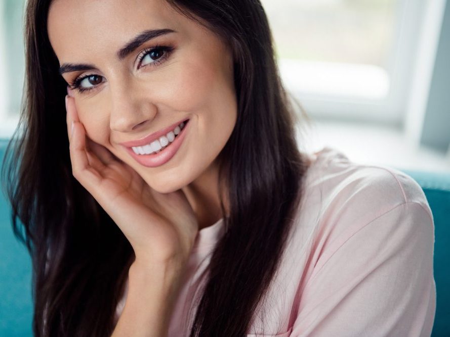 A patient smiling after cosmetic treatment
