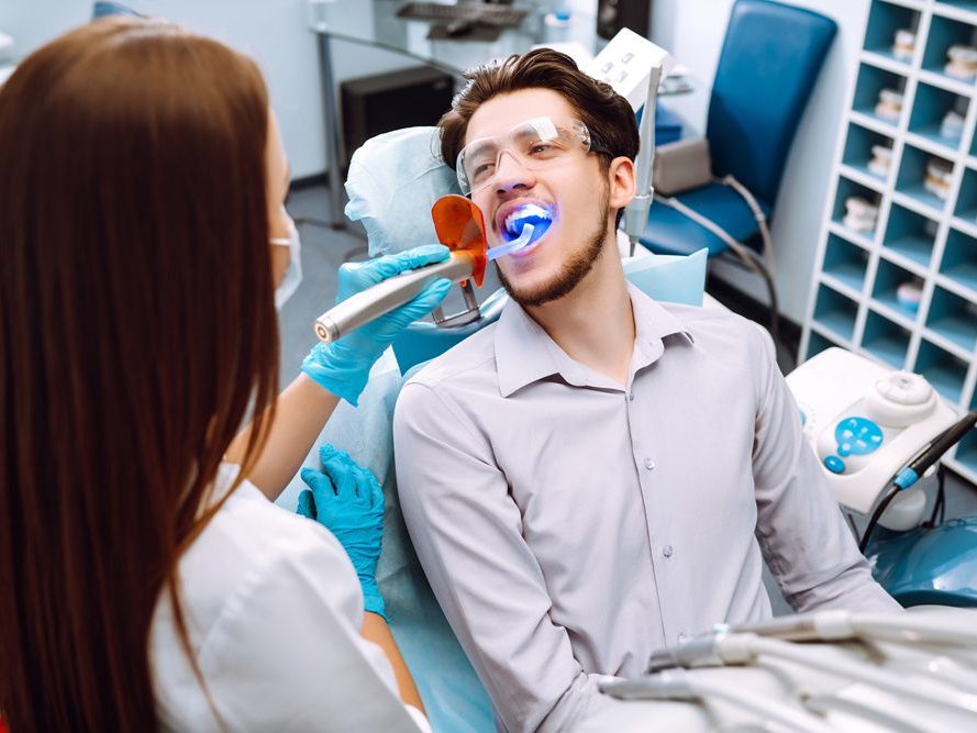 A patient smiling in the dental chair