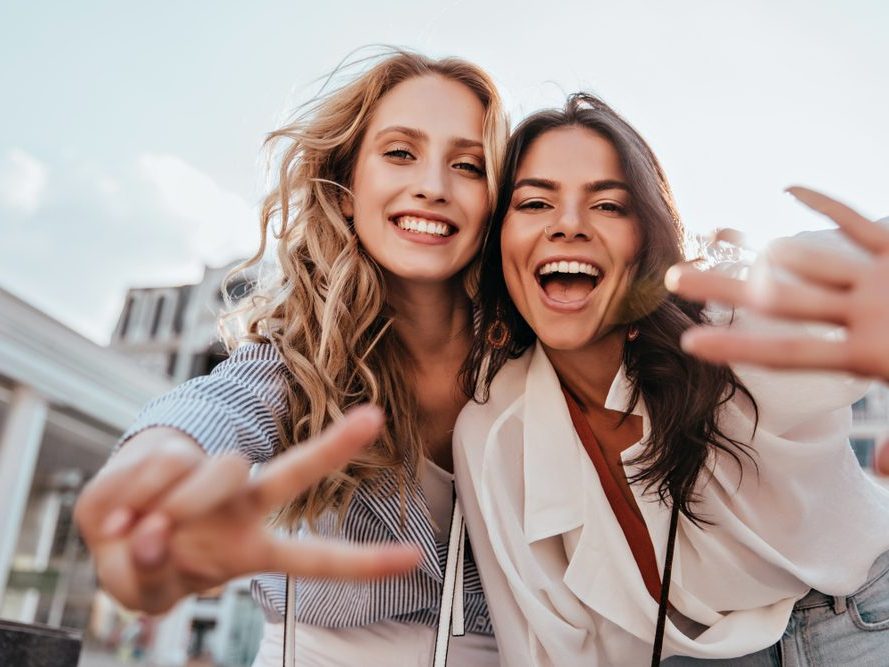Two friends laughing together