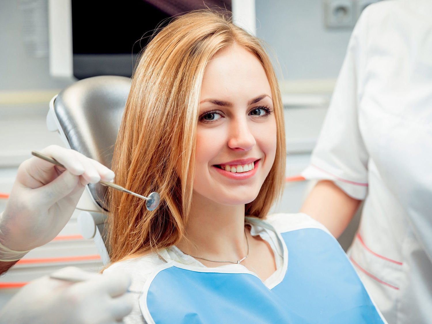 A patient having a tooth shade matched
