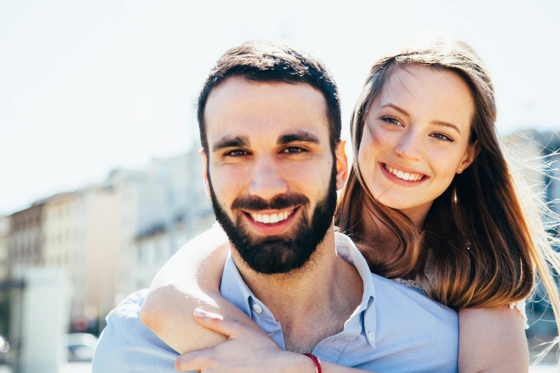 A dentist attentively examining a patient holding their cheek in a modern dental clinic.