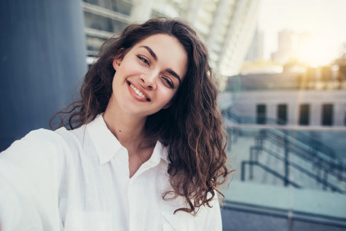 A dentist gently examining a patient in a dental chair inside a modern dental clinic during a dental emergency.